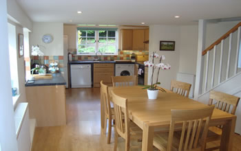 Enford House holiday cottage in Wiltshire has a well equipped kitchen  with lots of natural light and a large table