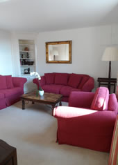 Enford House self catering holiday cottage has a beautiful garden surrounded by a thatched wall